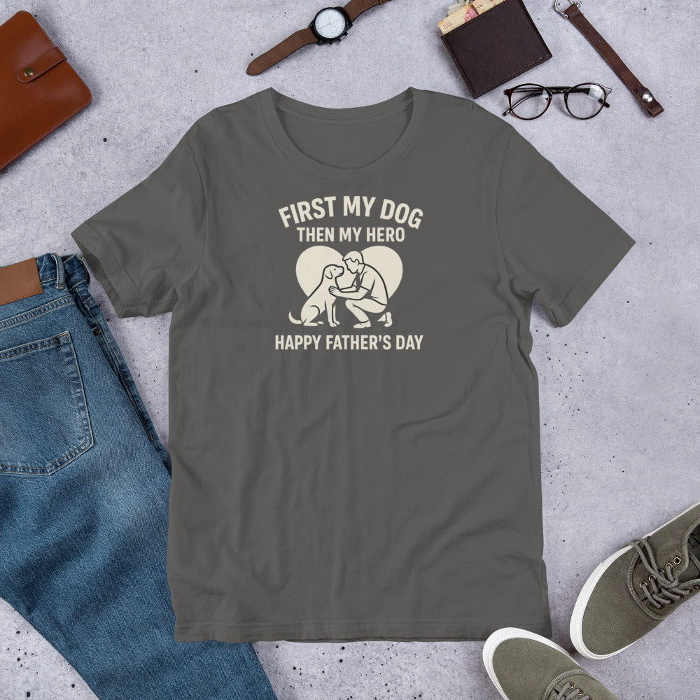"First My Dog Then My Hero" - Fun Labrador T-Shirt Gray t-shirt with a graphic and text on a concrete surface with jeans, shoes, and accessories.