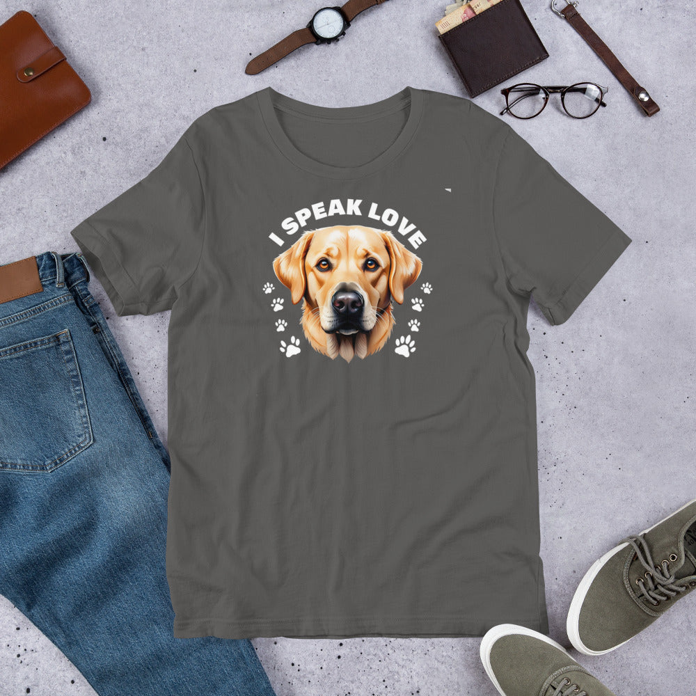 "I Speak Love" - Fun Labrador T-Shirt Gray t-shirt with a dog graphic and 'I Speak Love' text, surrounded by jeans, shoes, and accessories on a concrete surface.