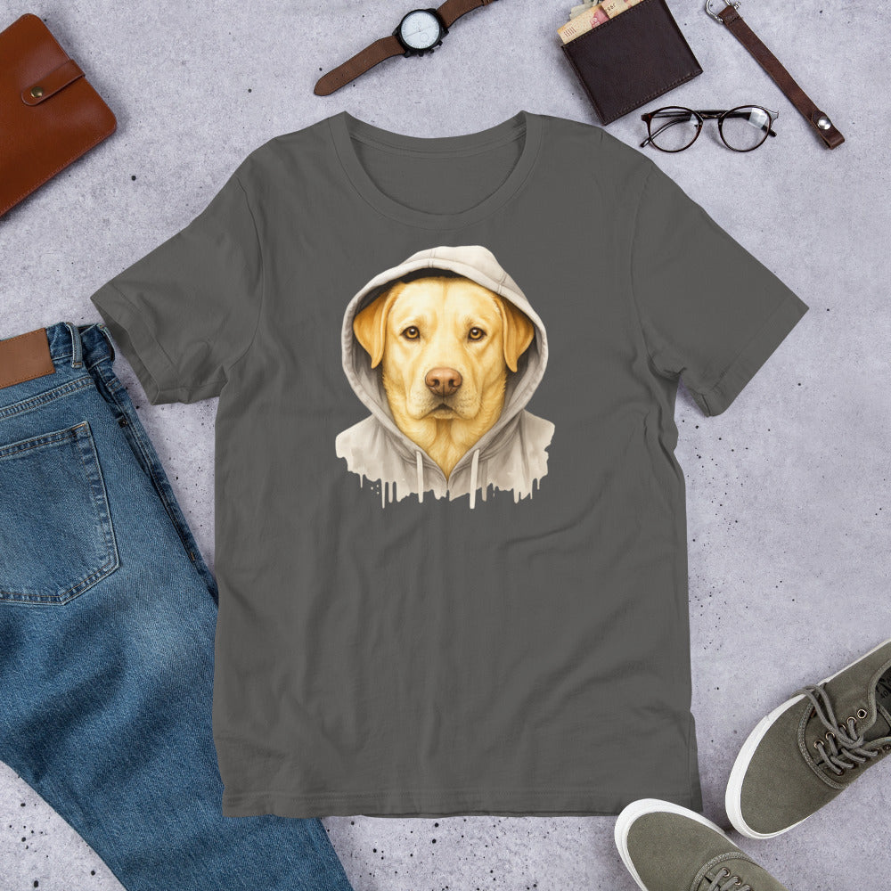 "Yellow Labrador In A Hoodie " – Fun Labrador T-Shirt Gray t-shirt with a dog wearing a hoodie graphic, surrounded by jeans, shoes, and accessories on a concrete surface.