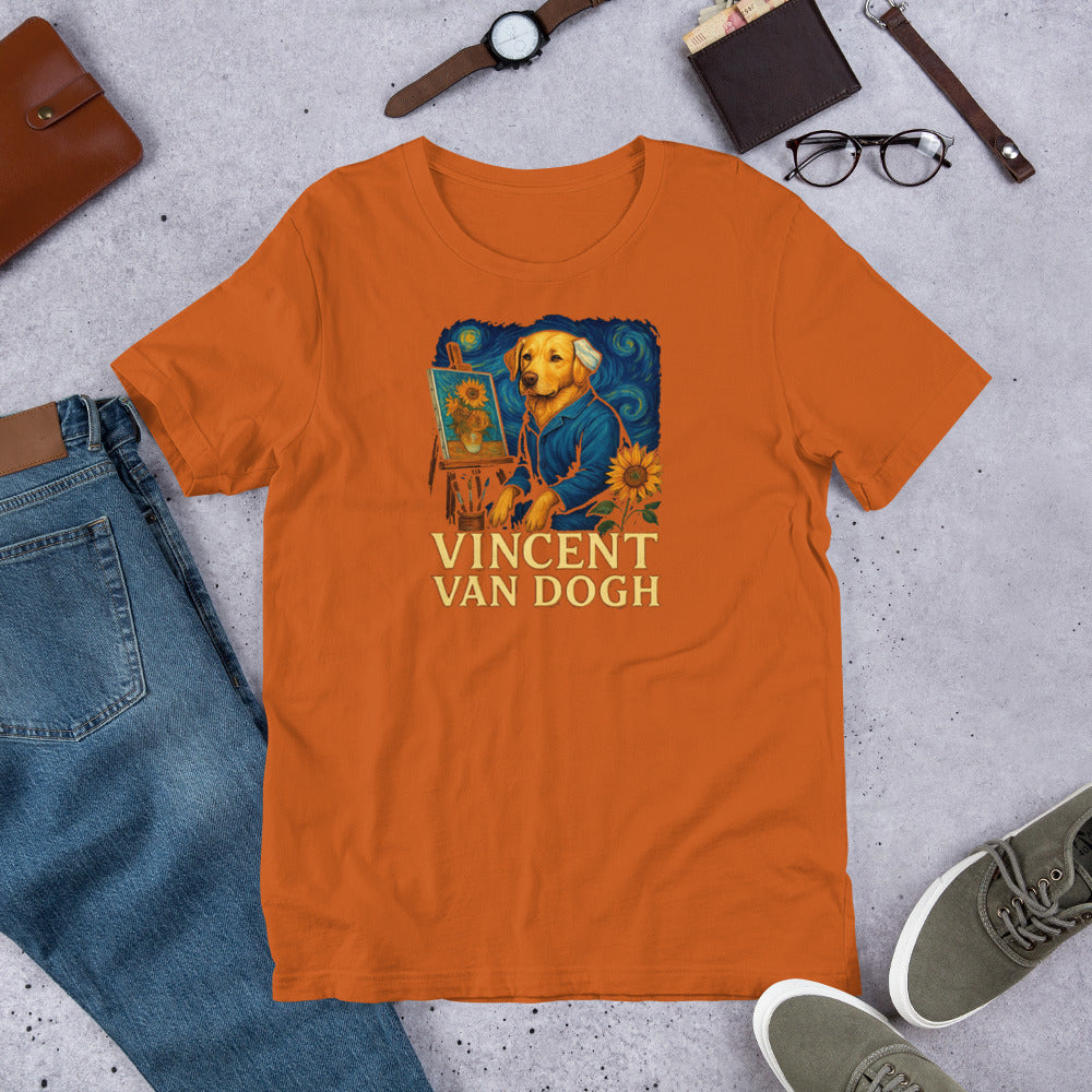 "Vincent Van Dogh " – Fun Labrador T-Shirt Orange t-shirt with 'Vincent Van Dogh' design on a concrete surface with jeans, shoes, and accessories.
