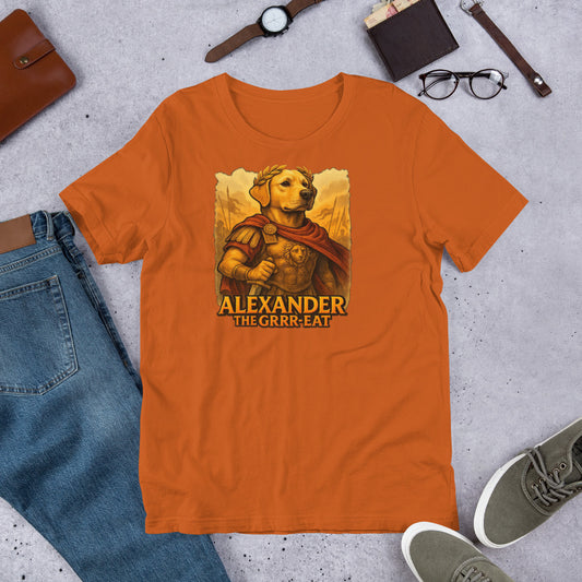 "Alexander The Grrr eat " – Fun Labrador T-Shirt Orange t-shirt with a graphic of a dog in armor and text 'Alexander The Grrr-reat' on a concrete surface with casual items.