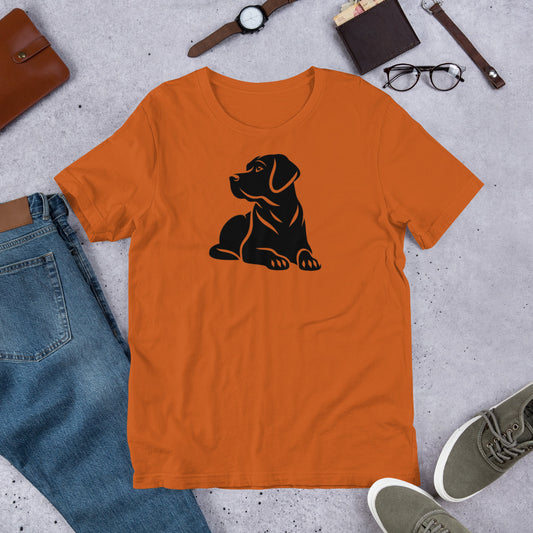 "Black Lab Lying Down " – Fun Labrador T-Shirt Orange t-shirt with a black dog graphic on a gray surface with jeans, shoes, and accessories.