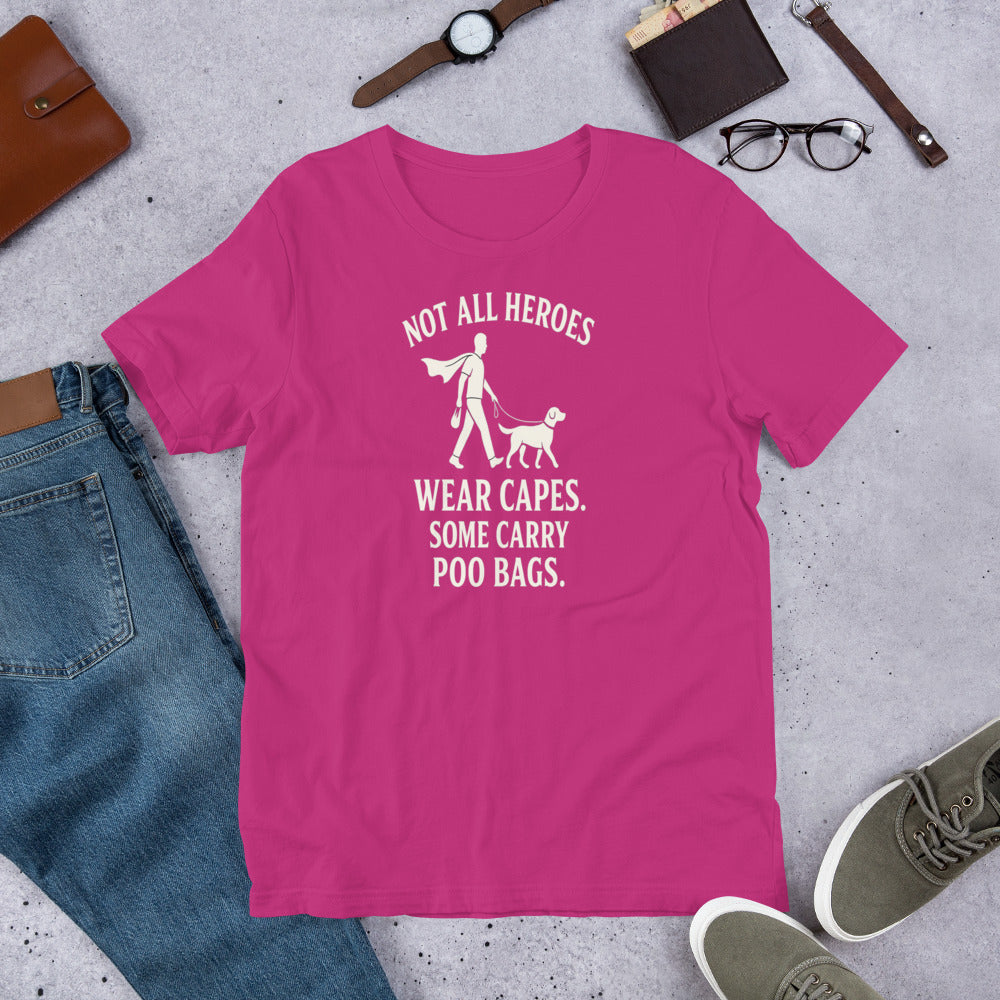 "Not All Heroes Wear Capes" - Fun Labrador T-Shirt Pink t-shirt with a graphic and text on a gray surface with casual items around