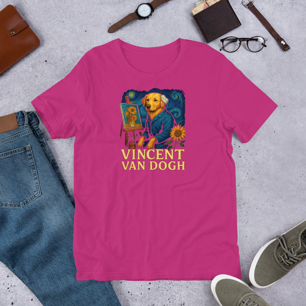 "Vincent Van Dogh " – Fun Labrador T-Shirt Pink t-shirt with a dog wearing a sweater and flowers graphic, labeled 'Vincent Van Dogh', on a concrete surface with jeans, shoes, and accessories.