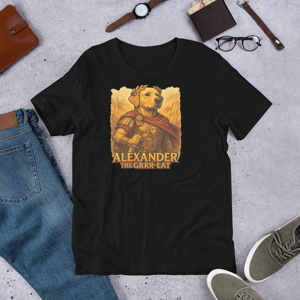 "Alexander The Grrr eat " – Fun Labrador T-Shirt Black t-shirt with a graphic of a dog in armor and 'Alexander The Grrr-reat' text, surrounded by jeans, shoes, and accessories on a concrete surface.