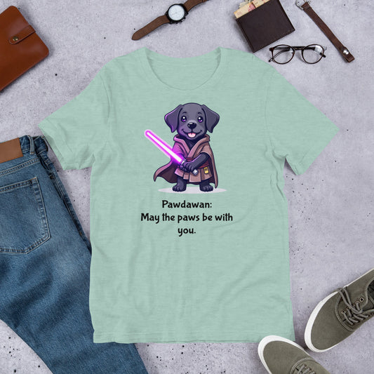 "Pawdawan " - Fun Labrador T-Shirt Light green t-shirt with a dog in a Jedi outfit and lightsaber graphic, surrounded by casual items on a concrete surface.