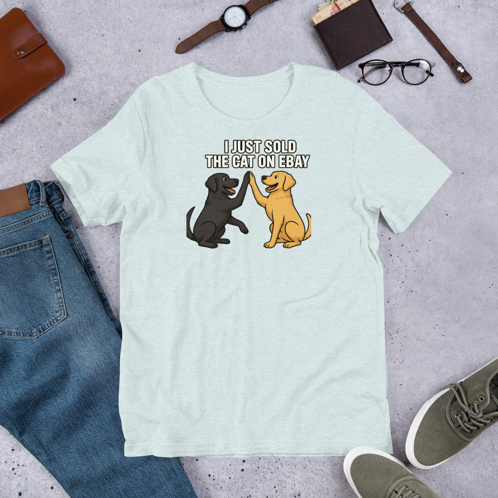 "I Just Sold The Cat On eBay" - Fun Labrador T-Shirt Light blue t-shirt with dog graphic and text on a gray surface with jeans, shoes, and accessories.