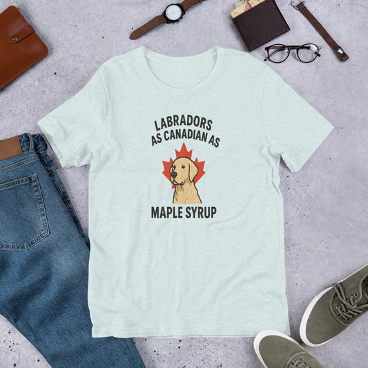 Labradors – As Canadian as Maple Syrup - Fun Labrador Tee Light blue t-shirt with a Labrador graphic and text on a gray surface with jeans, shoes, and accessories.