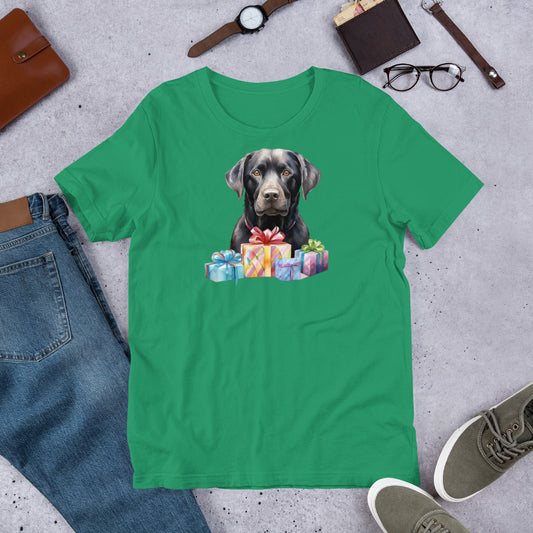"Black Lab With Presents " – Fun Labrador T-Shirt Green t-shirt with a dog and presents graphic on a gray surface with jeans, shoes, and accessories.