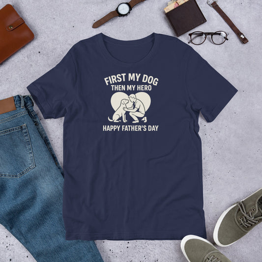 "First My Dog Then My Hero" - Fun Labrador T-Shirt Navy blue t-shirt with a graphic and text on a concrete surface with casual items.
