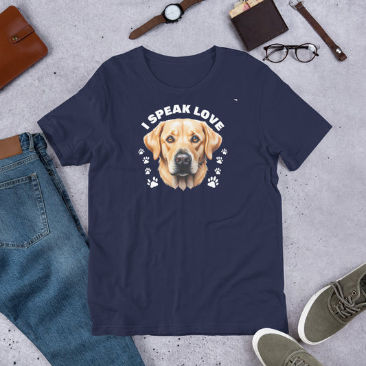 "I Speak Love" - Fun Labrador T-Shirt Navy blue t-shirt with a dog graphic and 'I Speak Love' text, surrounded by casual items on a concrete surface.
