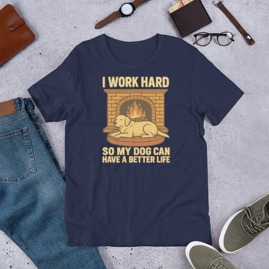 "I work Hard So My Dog Can Have A Better Life" - Fun Labrador T-Shirt Navy blue t-shirt with a graphic and text on a concrete surface with casual items around.