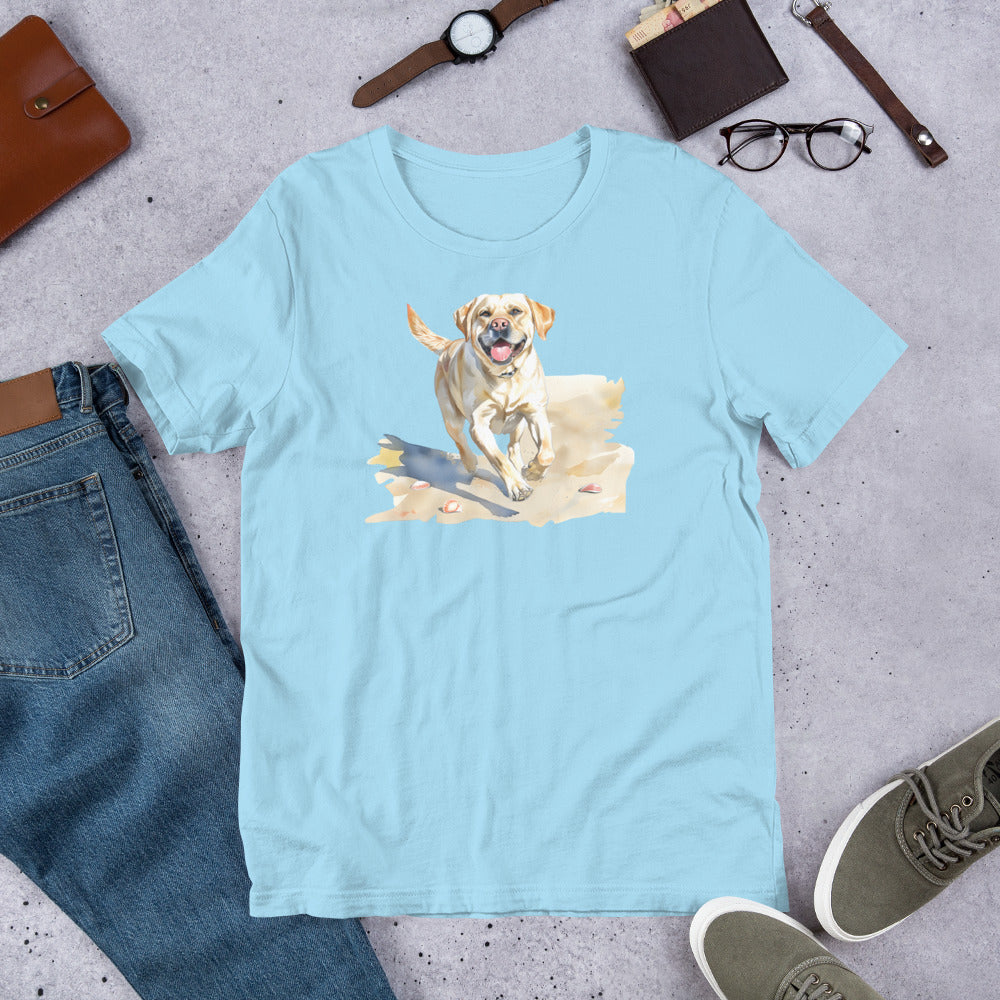 "Lab On A Beach " - Fun Labrador T-Shirt Light blue t-shirt with a dog graphic on a gray surface with jeans, shoes, and accessories.