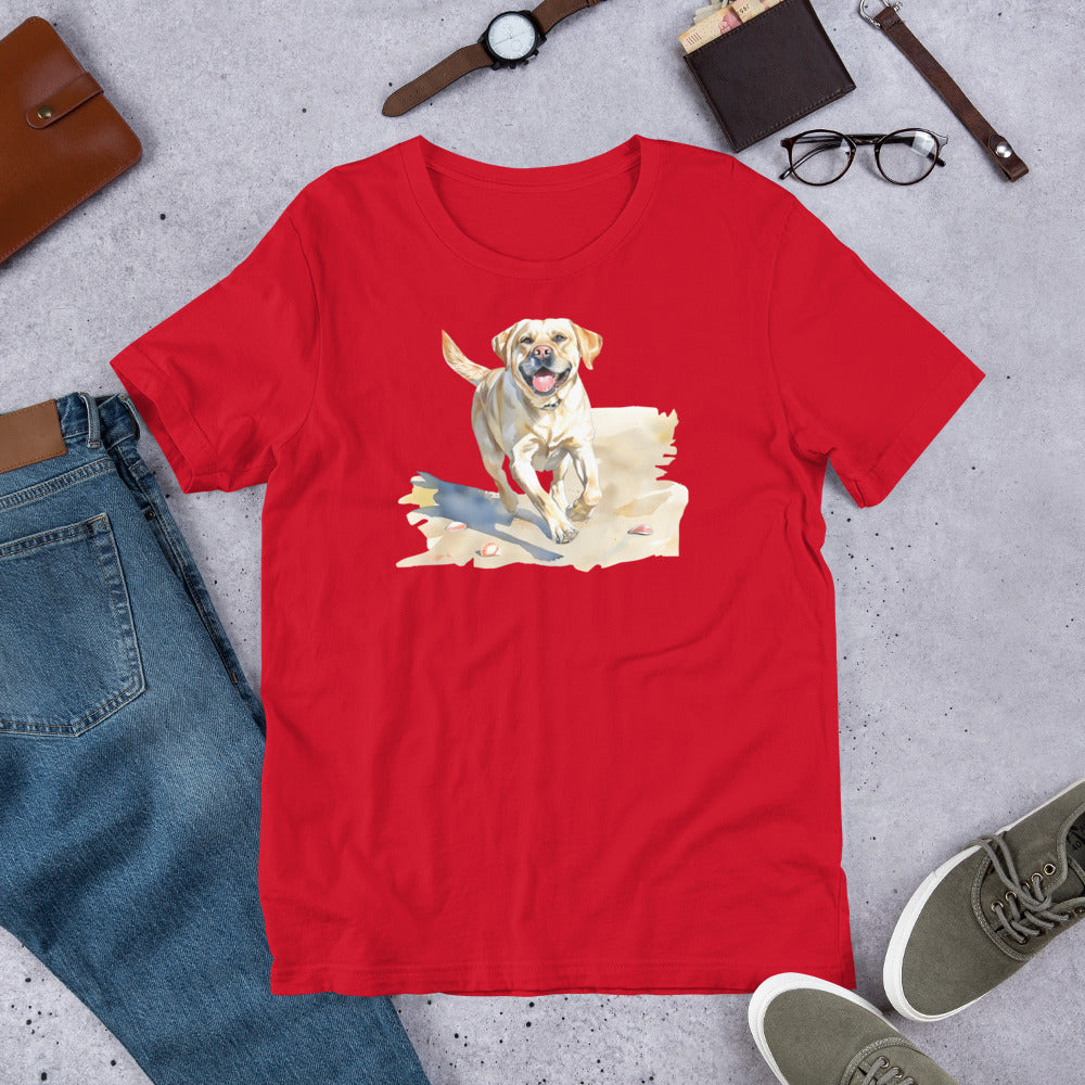 "Lab On A Beach " - Fun Labrador T-Shirt Red t-shirt with a dog graphic on a gray surface with casual items around