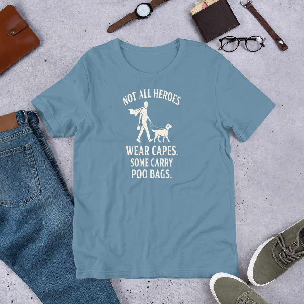 "Not All Heroes Wear Capes" - Fun Labrador T-Shirt Blue t-shirt with a humorous design on a concrete surface with jeans, shoes, and accessories.