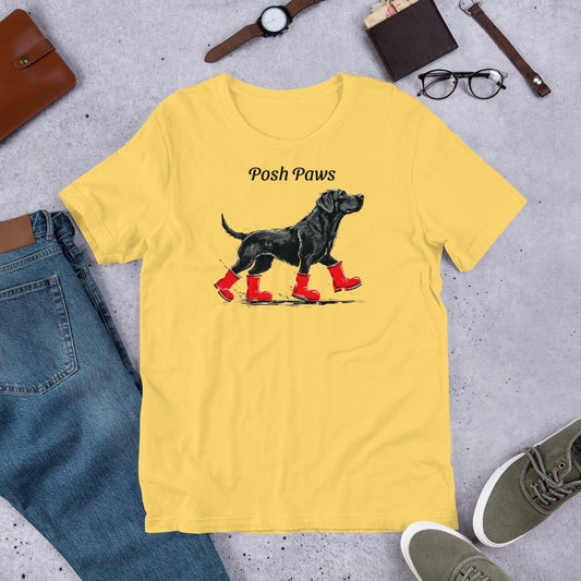 "Posh Paws" - Fun Labrador T-Shirt Yellow t-shirt with a dog graphic and 'Posh Paws' text, surrounded by jeans, shoes, and accessories on a concrete surface.