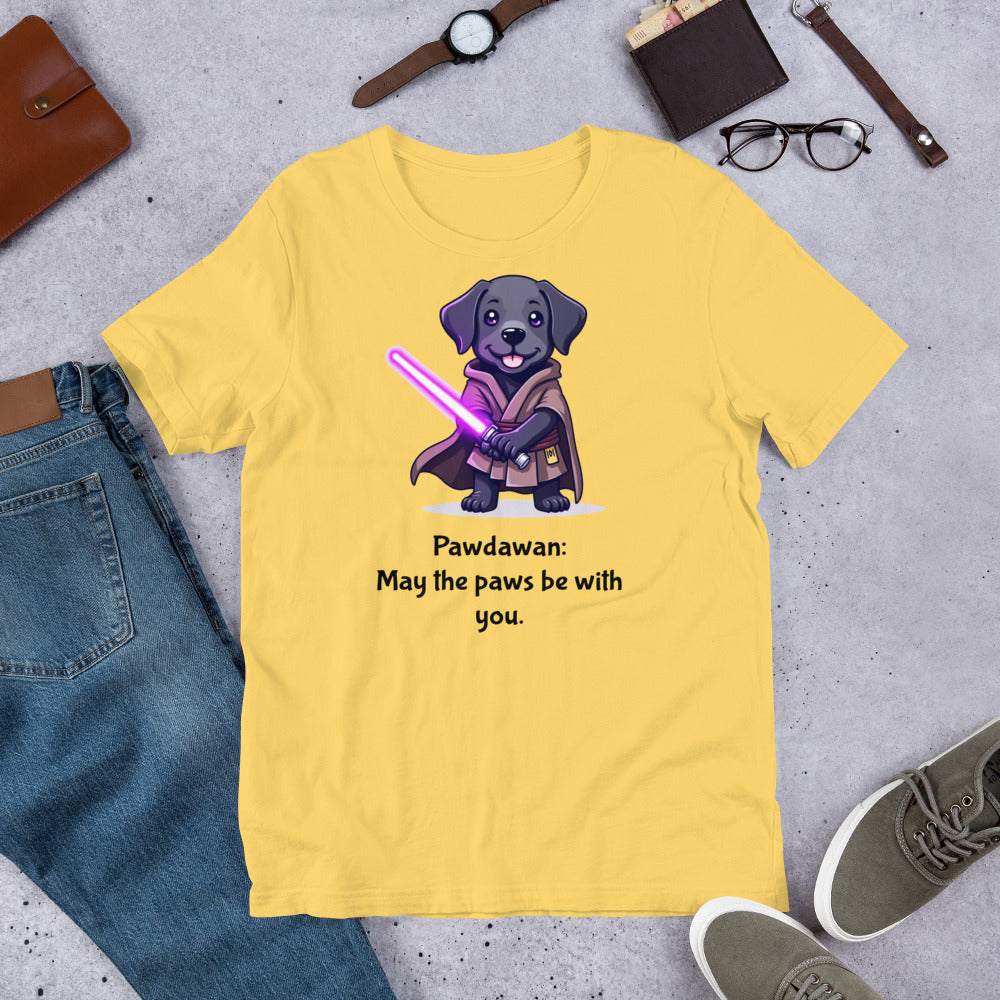 "Pawdawan " - Fun Labrador T-Shirt Yellow t-shirt with a dog graphic and text on a concrete surface with casual items.