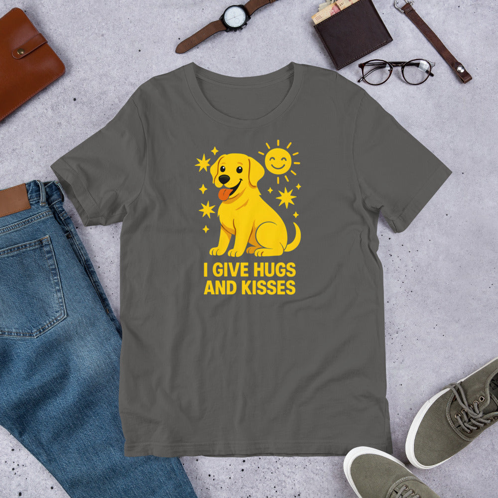 "I Give Hugs And Kisses " – Fun Labrador T-Shirt Gray t-shirt with a yellow dog graphic and text on a concrete surface with jeans, shoes, and accessories.