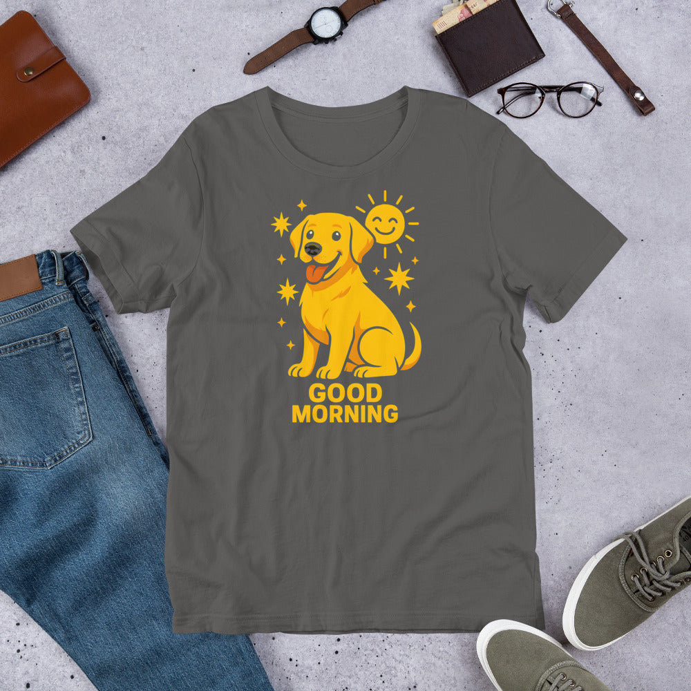 "Good Morning " – Fun Labrador T-Shirt Gray t-shirt with a yellow dog graphic and 'Good Morning' text on a concrete surface with casual items.