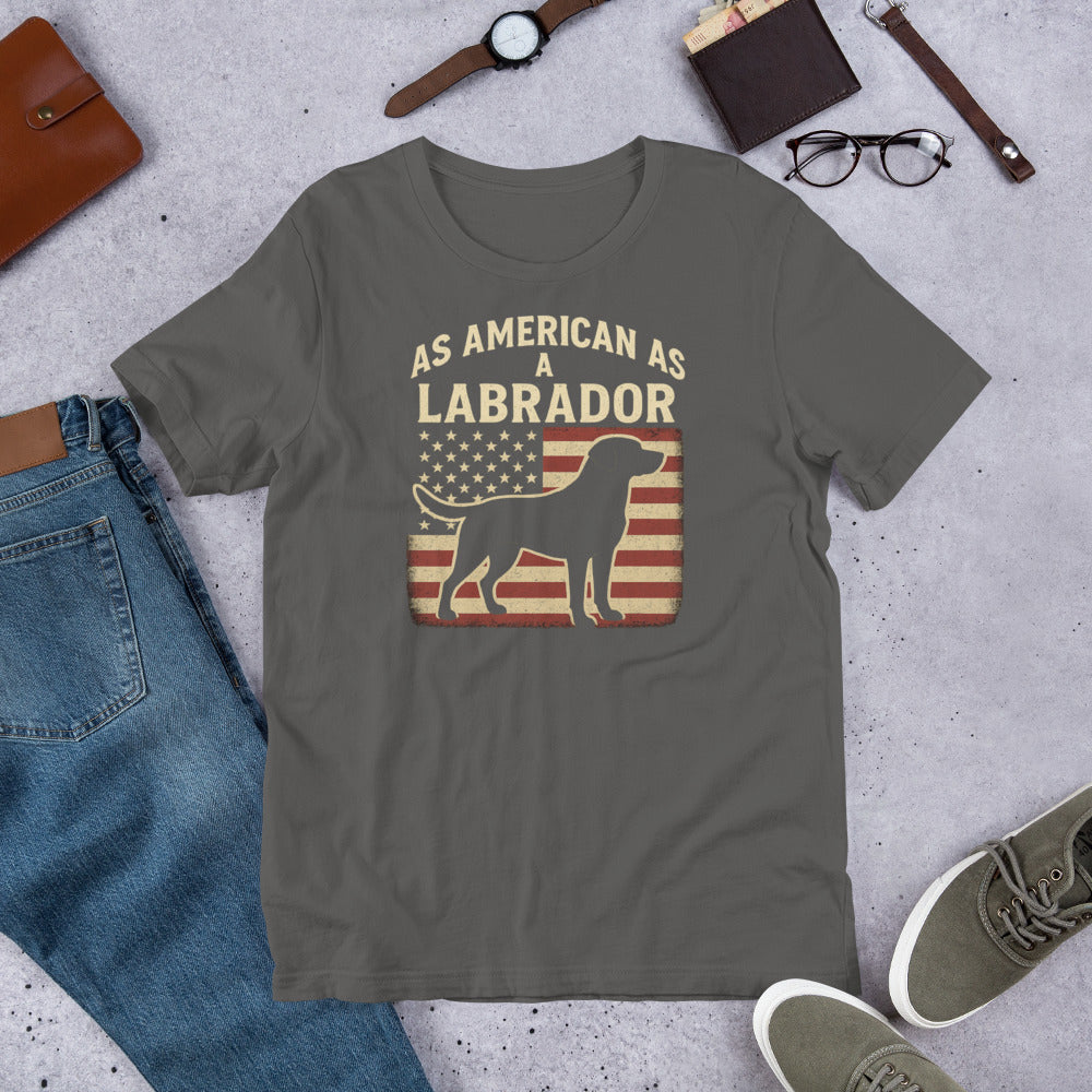 As American As A Labrador - Fun Labrador Tee Gray t-shirt with 'As American as a Labrador' graphic on a concrete surface with jeans, shoes, and accessories.