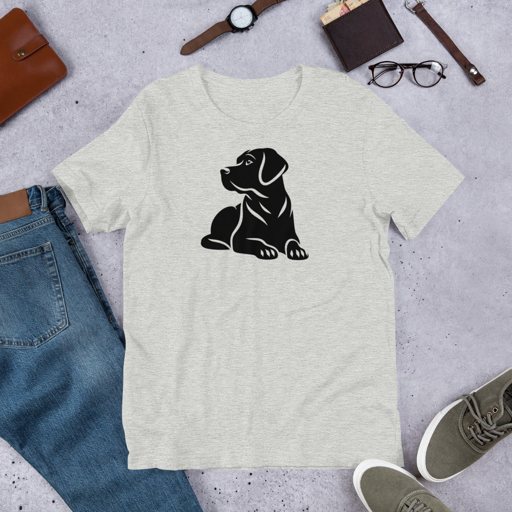 "Black Lab Lying Down " – Fun Labrador T-Shirt Gray t-shirt with a black dog graphic on a gray surface with jeans, shoes, and accessories.