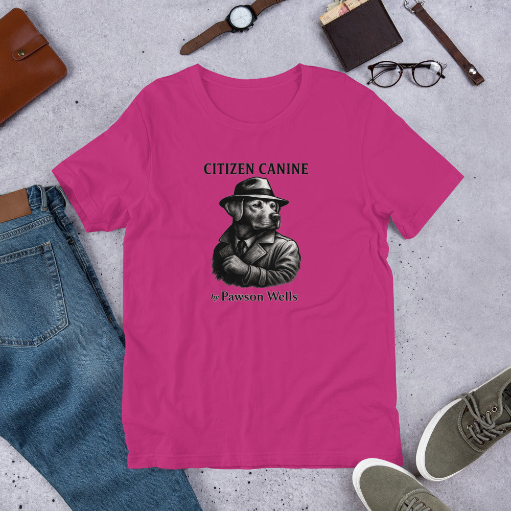 "Citizen Canine" - Fun Labrador T-Shirt Pink t-shirt with a dog graphic and text on a gray surface with casual items.