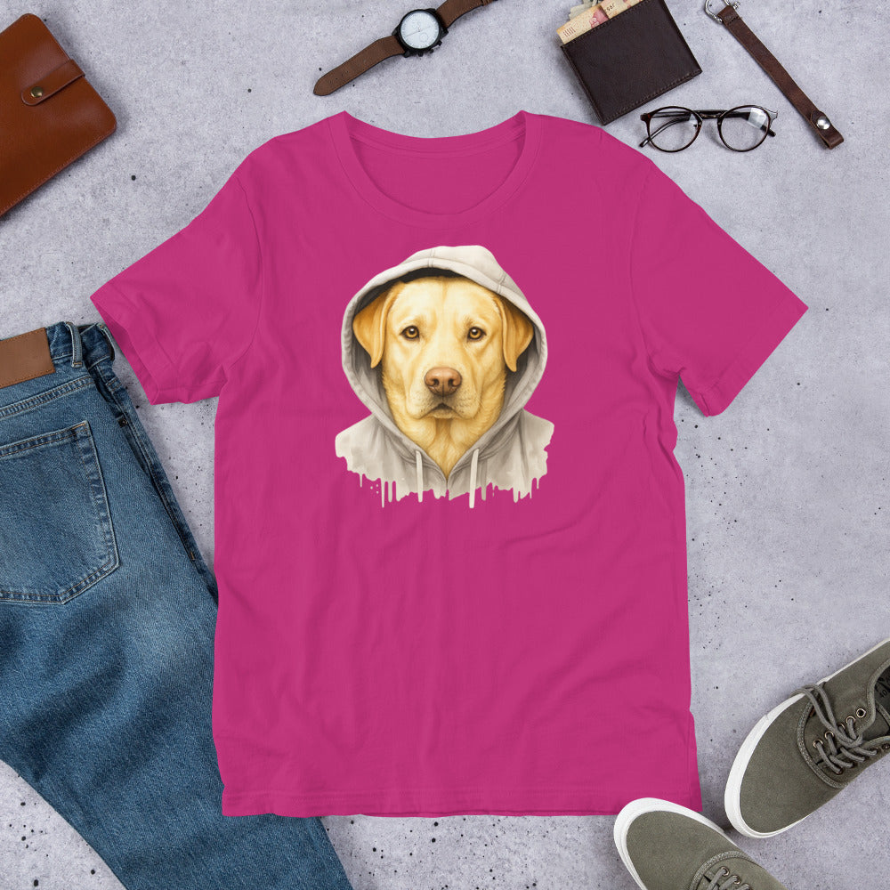 "Yellow Labrador In A Hoodie " – Fun Labrador T-Shirt Pink t-shirt with a dog in a hoodie graphic on a gray surface with jeans, shoes, and accessories.