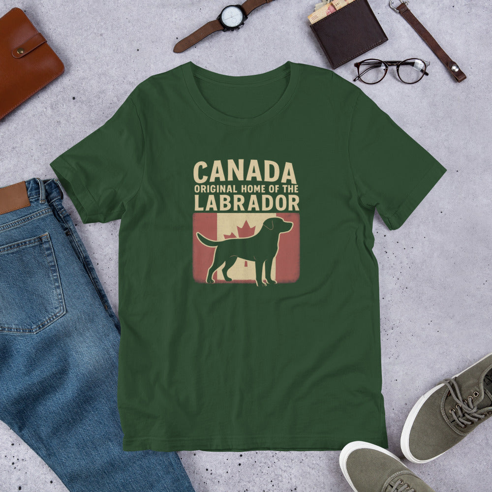 Canada – Original Home of the Labrador - Fun Labrador Tee Green t-shirt with Labrador and Canada text on a concrete surface with jeans, shoes, and accessories.