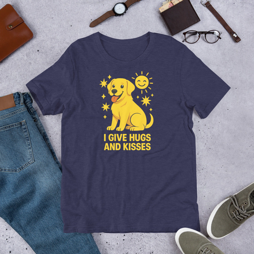 "I Give Hugs And Kisses " – Fun Labrador T-Shirt Navy blue t-shirt with yellow dog graphic and text 'I give hugs and kisses' on a concrete surface with casual items.