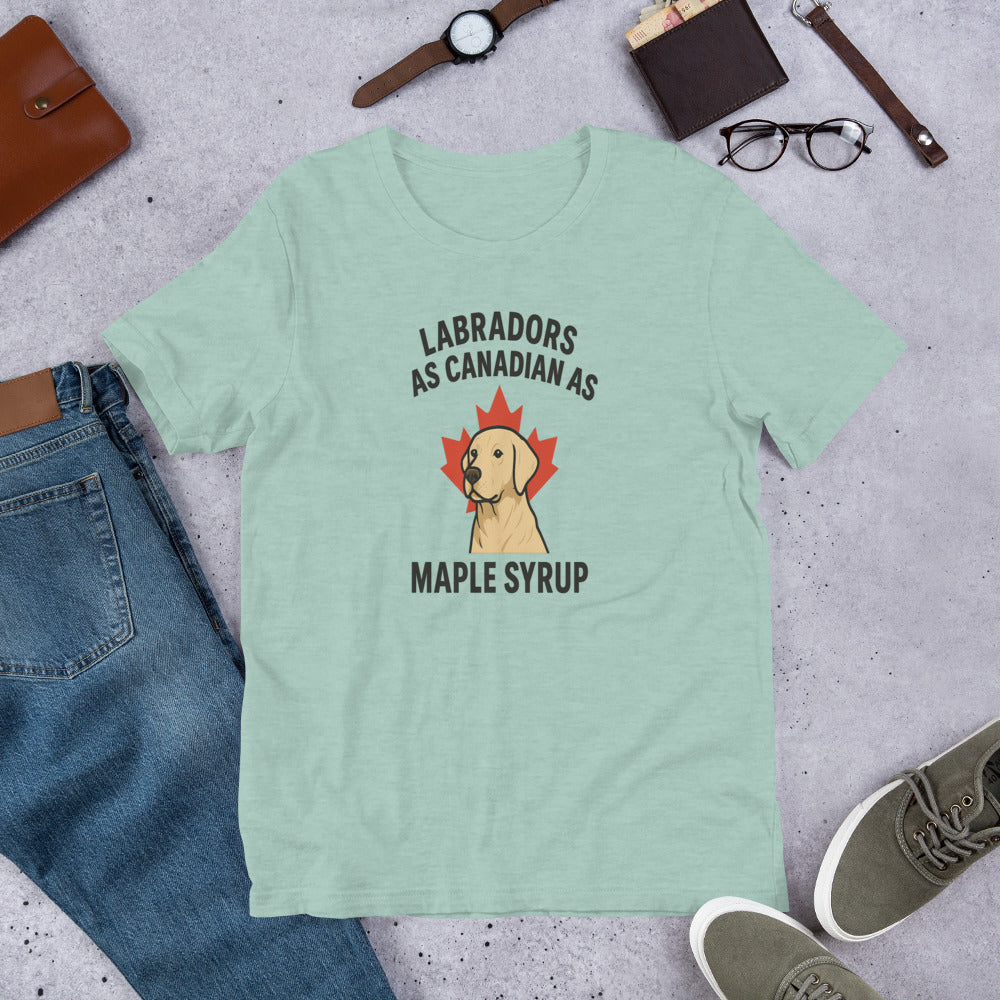 Labradors – As Canadian as Maple Syrup - Fun Labrador Tee Light green t-shirt with a Labrador graphic and text on a gray surface with jeans, shoes, and accessories.
