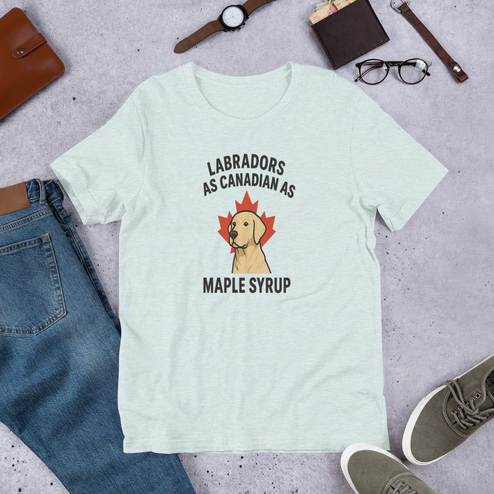 Labradors – As Canadian as Maple Syrup - Fun Labrador Tee Light blue t-shirt with a Labrador graphic and text on a gray surface with jeans, shoes, and accessories.