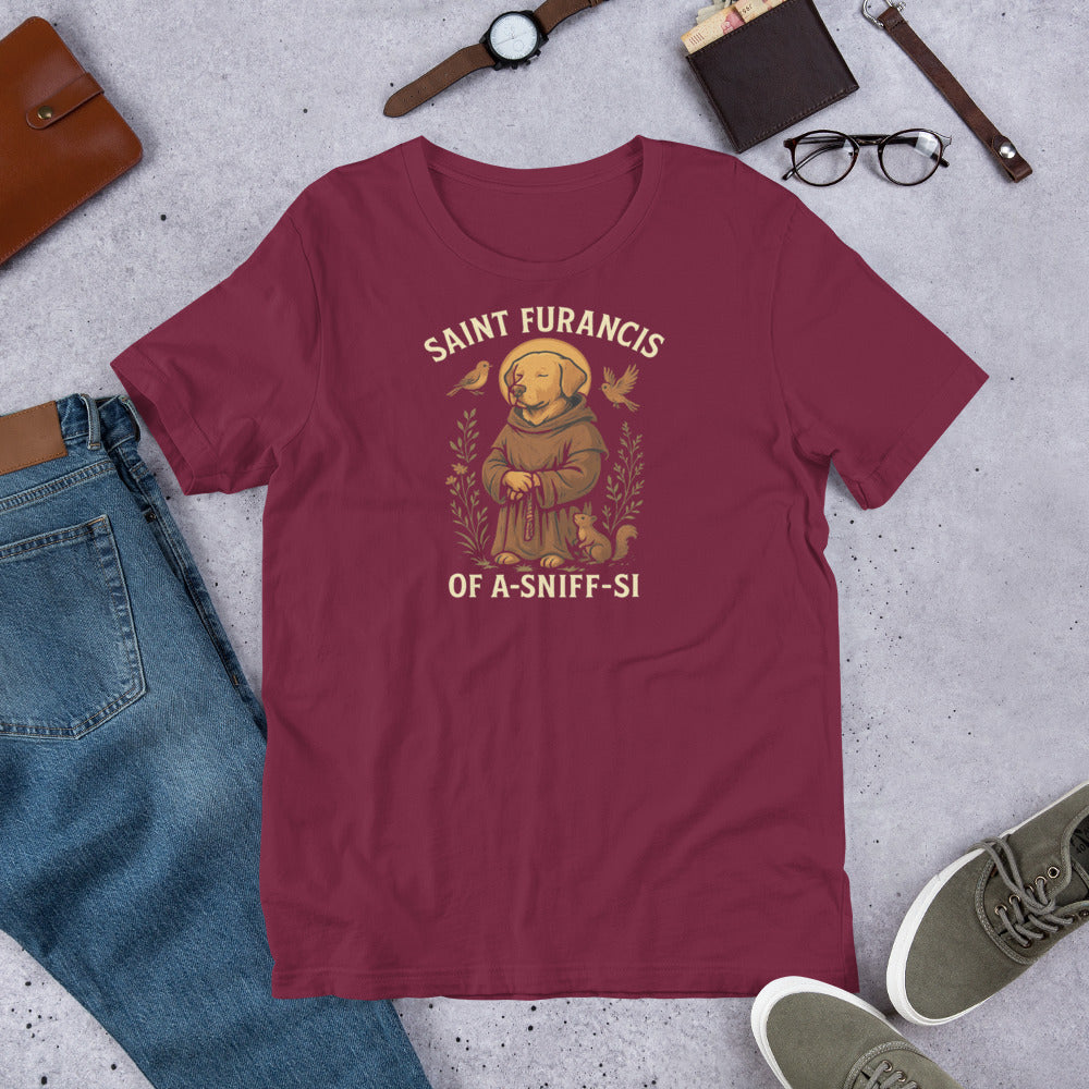 "Saint Furances Of A-Sniff-Si " – Fun Labrador T-Shirt Maroon t-shirt with 'Saint Furancis of a-Sniff-si' graphic on a concrete surface with casual items.