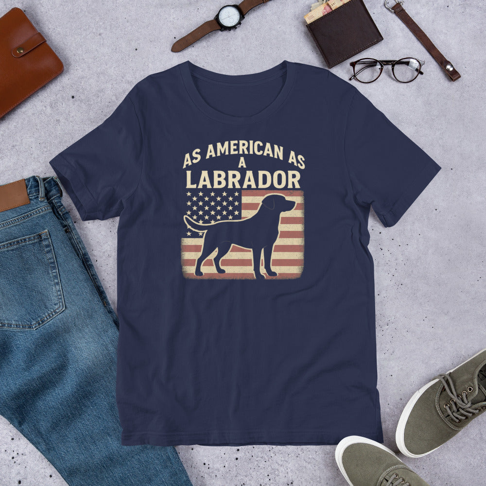 As American As A Labrador - Fun Labrador Tee Navy blue t-shirt with 'As American as a Labrador' graphic on a concrete surface with jeans, shoes, and accessories.