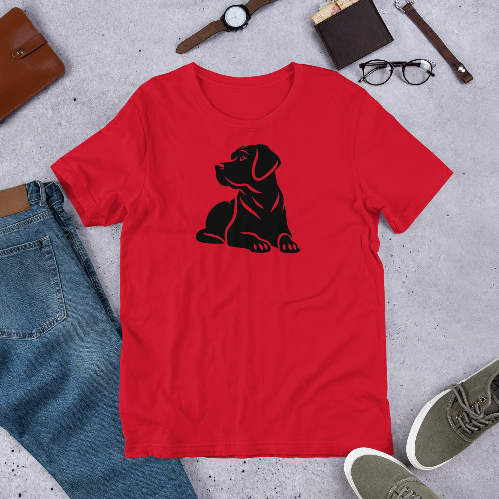 "Black Lab Lying Down " – Fun Labrador T-Shirt Red t-shirt with a black dog graphic on a gray surface with jeans, shoes, and accessories.