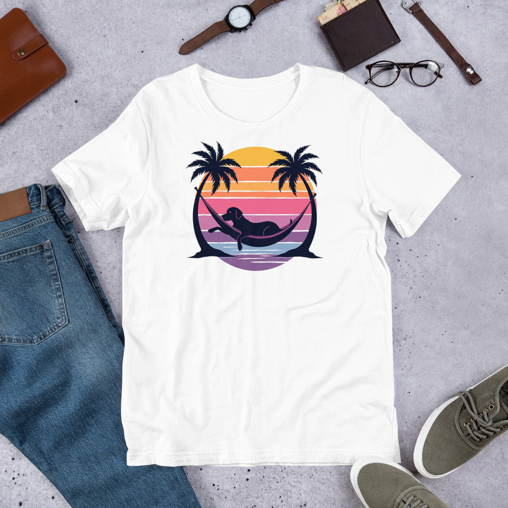 "Labrador In Paradise " – Fun Labrador T-Shirt White t-shirt with a colorful mermaid and palm tree design on a gray surface with jeans, shoes, and accessories.
