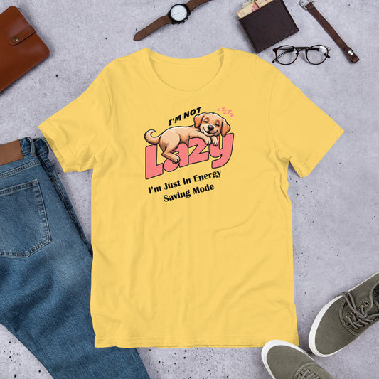 "I'm Not Lazy" - Fun Labrador T-Shirt Yellow t-shirt with a dog graphic and text on a gray surface with jeans, shoes, and accessories.